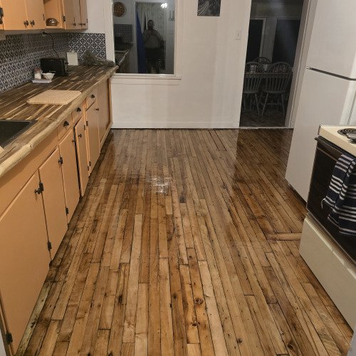 Tar covered floor to dream kitchen!